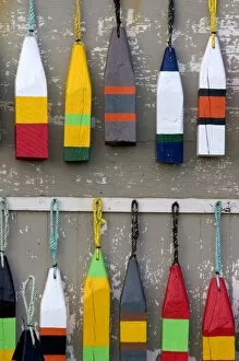 Lobster buoys hang on a wall at a village north of North Rustico on Prince Edward Island, Canada