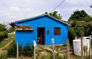 Images Dated 3rd February 2010: Local house painted blue in small village of Manaca Iznaca Estate home of the Plantation
