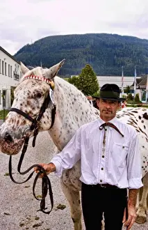 Event Prints: Local man with horse for show at horse show event in Tamsweg Austria alpine village