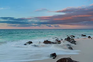 Away From It All Prints: Long exposure of Indian Ocean surf surging onto a rocky beach at sunset