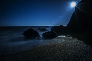 Spark Prints: Long exposure of sun on beach and rocks on northern California coastline