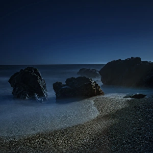 Spark Prints: Long exposure of sunlight on beach and rocks on northern California coastline