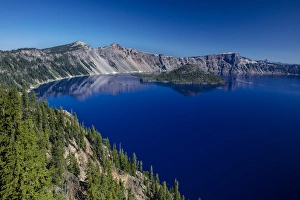 Looking down on blue waters of Crater Lake in Crater Lake National Park, Oregon, USA