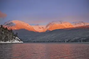 Images Dated 3rd January 2009: Looking toward Rocky Point the peaks catch alpenglow and reflect into Lake McDonald