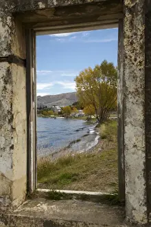 Gold Rush Prints: Looking through window of derelict building to Lake Dunstan and Old Cromwell Town