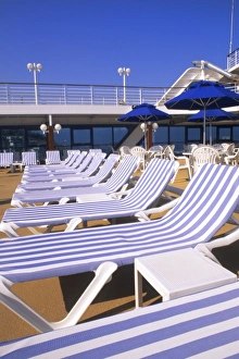 Deck Prints: Lounge chairs, tables, umbrellas on the deck of a cruise ship