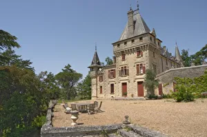 Images Dated 27th May 2005: The magnificent Chateau de Pressac and garden furniture on the terrace Chateau de