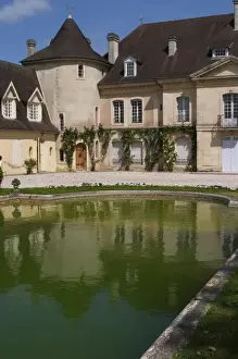 Cru Classe Prints: The main building with its tower and a pond with a reflection Chateau Bouscaut Cru