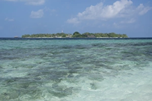 Atoll Prints: Maldives, North Male Atoll, Island of Kuda Bandos. View of the resort island of Bandos