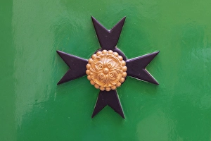 Malta Prints: Malta, Birgu. Maltese Cross plaque on a green wall