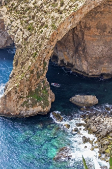 Turquoise Prints: Malta. The Blue Grotto, seen from above. Small tour boat