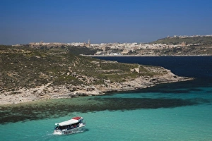 Images Dated 31st March 2010: Malta, Comino Island, The Blue Lagoon with tour boat