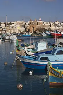 Malta, Southeast, Marsaxlokk, harbor and traditional Luzzu fishing boats