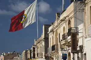 Marsaxlokk Prints: Malta, Southeast, Marsaxlokk, waterfront buildings and flag