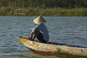 Images Dated 12th June 2018: Man fishing from boat on Thu Bon River, Hoi An (UNESCO World Heritage Site), Vietnam