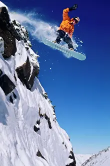 Recreation Prints: Man on a snowboard jumping off a cornice at Snowbird Resort in Little Cottonwood