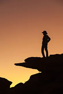 Brenda Tharp Prints: Man standing on rock surveying the view. (MR)