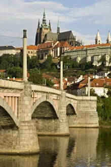 Manes Bridge with the St. Vitus Cathedral and the Prague Castle, in the background