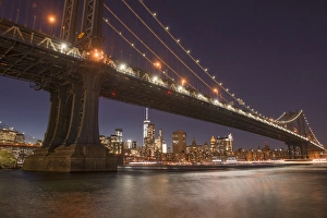 New York Prints: The Manhattan Bridge and Manhattan skyline in the evening light from Brooklyn Bridge Park