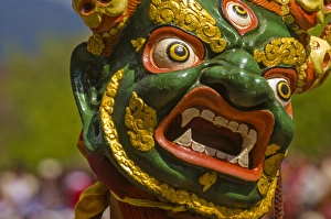 Dance Prints: Mask of dancer at religious festivity with many visitors, Paro Tsechu, Bhutan, Asia