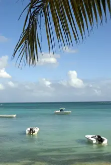 Peter Skinner Prints: Mauritius, Grand Baie. Boats anchored in the calm tropical waters of Grand Baie
