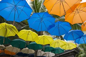 Hang Prints: Mauritius, Port Louis, Caudan waterfront area with colorful umbrella covering