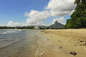 Images Dated 30th April 2008: Mauritius, Tamarin, view of calm beach with trees and mountain peak in the background