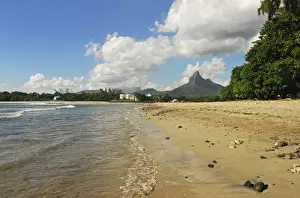 Mauritius Prints: Mauritius, Tamarin, view of calm beach with trees and mountain peak in the background