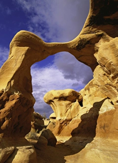 Redrock Prints: Metate Arch stands guard in Devils Garden, Grand Staircase National Monument, Utah