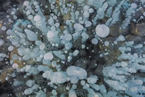 Methane Prints: Methane ice bubbles under clear ice on Abraham Lake near Nordegg, Alberta, Canada