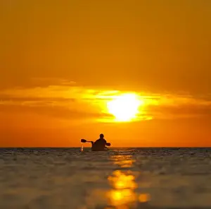 Images Dated 21st April 2009: Mexico, Baja, Sea of Cortez. Sea Kayaker and sunrise. (MR)