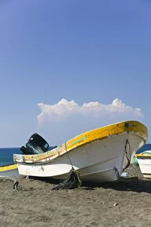 Mexico, Colima, Cuyutlan. Fishing Boat on Black Sand Beach
