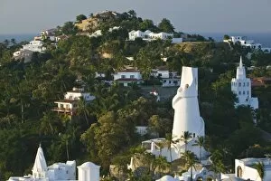 Images Dated 9th December 2006: Mexico, Colima, Manzanillo. Brisas Las Hadas Resort Water Tower / Sunrise