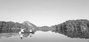 Black And White Prints: Mexico, CONANP park ranger patrols with his son on Lake Itsanok uk near Metzabok