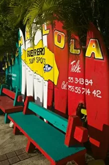 Mexico, Guerrero, Ixtapa. Catcha La Ola Surf Shop Sign