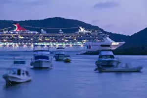 Zihuatanejo Prints: Mexico, Guerrero, Zihuatanejo. Cruiseship off Playa Municipal / Dusk