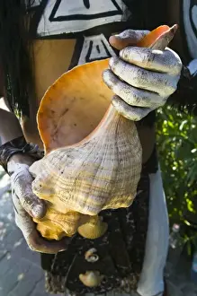 Zihuatanejo Prints: Mexico, Guerrero, Zihuatanejo. Young Man in Mayan Costume (MR) holding large Conch Shell