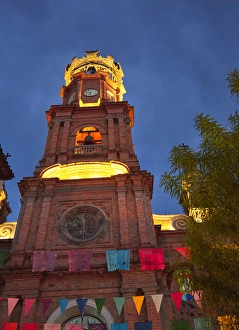 Mexico, Jalisco, Puerto Vallarta. Exterior of Our Lady of Guadalupe church at night