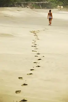 Lifestyle Prints: Mexico, Mazunte, view of footprints of woman in bikini walking on sand at the beach