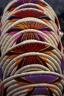 Images Dated 29th December 2003: Mexico, Oaxaca. Colorful straw and woven handicrafts (baskets) from Jamiltepex Village