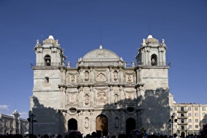 Mexico, Oaxaca, Setting sun lights Cathedral of the Virgin of the Assumption along Mexico, Oaxaca, Setting sun lights Cathedral of the Virgin of the Assumption along