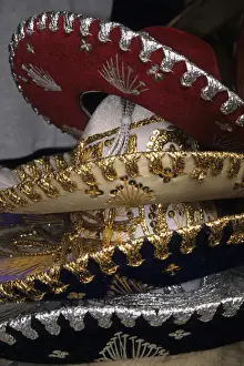 Mexico, Puerta Vallarta. Traditional hats stacked on display