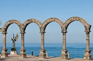 Images Dated 10th November 2010: Mexico, Puerto Vallarta. Los Arcos and Angel of Hope and Messenger of Peace sculpture
