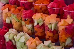 Mexico, San Miguel de Allende. Array of fruit cups for sale at a market
