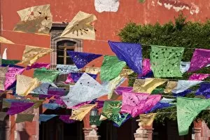 Mexico, San Miguel de Allende. Banners decorate the main square to celebrate Day