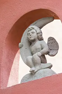 Images Dated 8th March 2013: Mexico, San Miguel de Allende. Cherub holding quarter moon