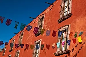 Images Dated 18th December 2008: Mexico, San Miguel de Allende. Colorful banners strung across street