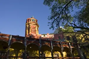 Mexico, San Miguel de Allende. Colorful red tower against clear blue sky Credit as