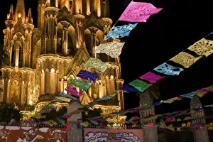 Images Dated 1st November 2006: Mexico, San Miguel de Allende. Festival banners fly at night in front of illuminated