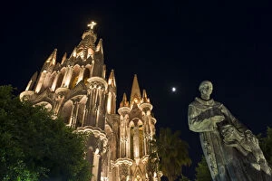 Mexico, San Miguel de Allende. Night view of lighted La Parroquia, the parish church